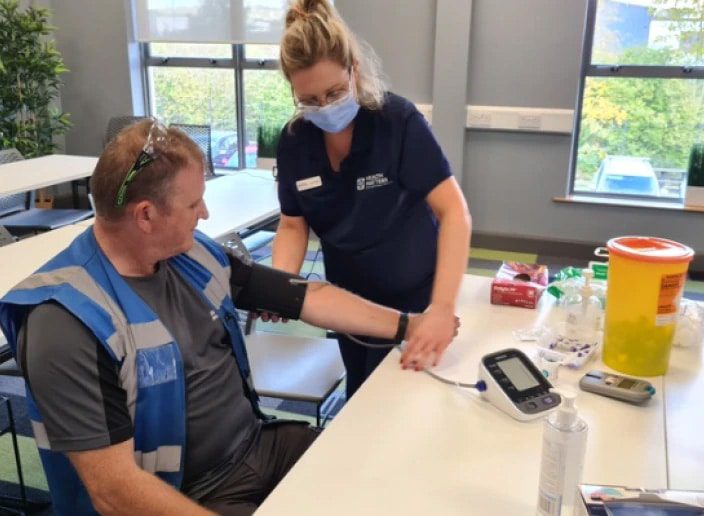 Smiley Monroe employee receiving health check
